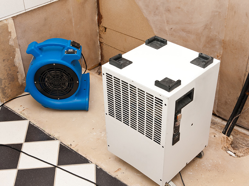 dyer and dehumidifier machines at property for water damage restoration dehumidify